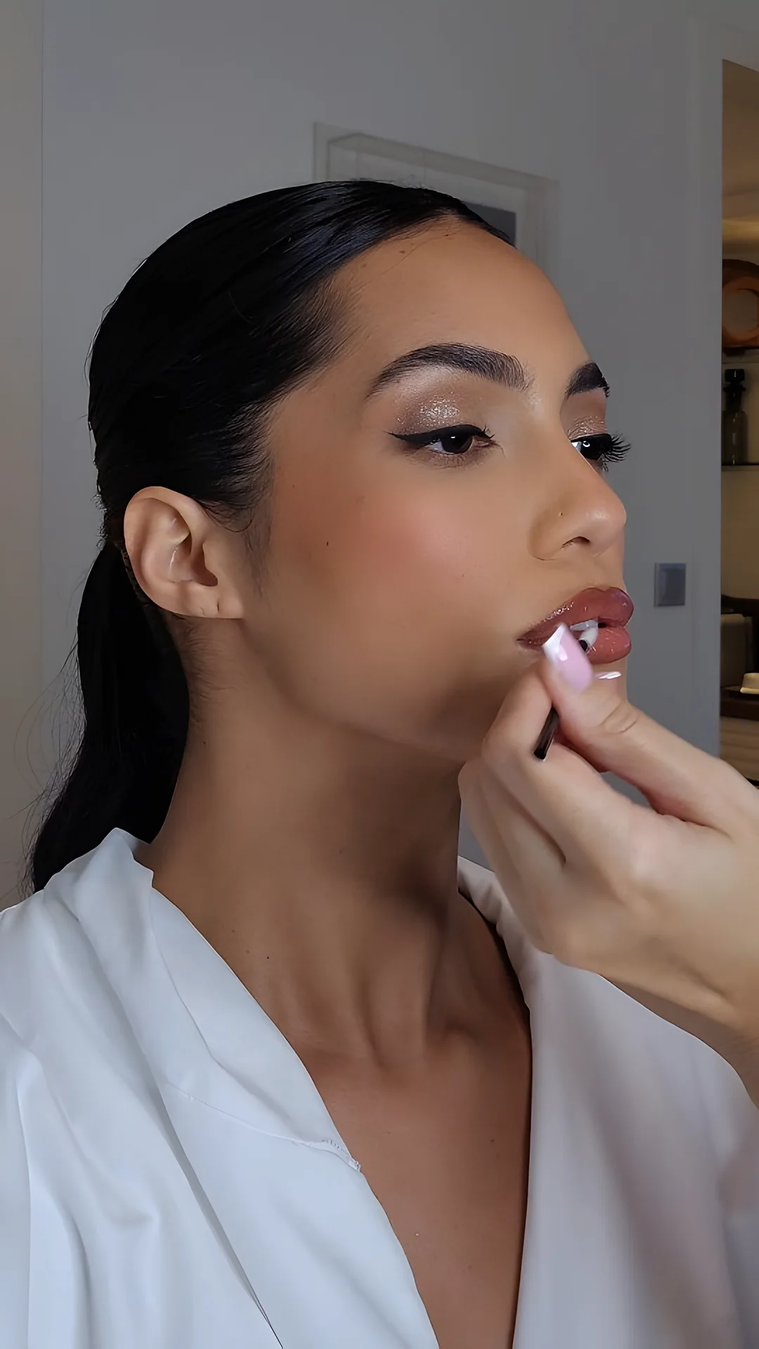 Lip touch-up on set